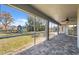 Screened porch overlooking the backyard with playset at 3470 Cedar Crest Loop, Spring Hill, FL 34609