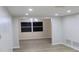 Spacious dining area with large windows and wood-look floors at 3518 Moog Rd, Holiday, FL 34691