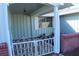 Inviting front entry with decorative gate and covered porch at 3518 Moog Rd, Holiday, FL 34691
