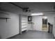 Garage with shelving, water heater, and access door at 3518 Moog Rd, Holiday, FL 34691