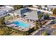 Community pool, clubhouse, and shuffleboard courts at 4231 Richmere Dr # 3D, New Port Richey, FL 34652