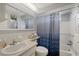 Clean bathroom with shower/tub combo and updated vanity at 4231 Richmere Dr # 3D, New Port Richey, FL 34652