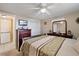Bright bedroom with a double bed and dresser at 4231 Richmere Dr # 3D, New Port Richey, FL 34652