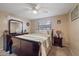 Cozy bedroom with a sleigh bed, dresser, and ceiling fan at 4231 Richmere Dr # 3D, New Port Richey, FL 34652
