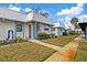Front view of charming Florida home with manicured landscaping and walkway at 4231 Richmere Dr # 3D, New Port Richey, FL 34652