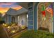 Evening view of house exterior with well-maintained landscaping at 4231 Richmere Dr # 3D, New Port Richey, FL 34652