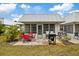 Backyard patio with seating, grill, and access to the house at 4231 Richmere Dr # 3D, New Port Richey, FL 34652