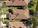 An aerial view displays the roof and surrounding yard of this lovely single-Gathering home at 4886 Westchester Ct, Oldsmar, FL 34677
