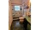 Stylish bathroom showcasing modern glass shower, updated fixtures, and green glass sink at 4886 Westchester Ct, Oldsmar, FL 34677