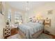 Bright bedroom with wood floors, window seat, and bay window at 4886 Westchester Ct, Oldsmar, FL 34677