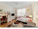 Well-lit bedroom featuring a twin bed, built-in shelving, and desk at 4886 Westchester Ct, Oldsmar, FL 34677
