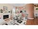 Elegant dining area with a fireplace, stylish table, and a convenient serving bar at 4886 Westchester Ct, Oldsmar, FL 34677