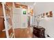 Bright and spacious entryway with decorative shelving and hardwood floors at 4886 Westchester Ct, Oldsmar, FL 34677