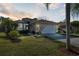 A charming one-story home featuring manicured landscaping and an attached two-car garage at 4886 Westchester Ct, Oldsmar, FL 34677
