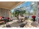 Relaxing screened lanai with comfortable seating overlooking serene water view and lush landscaping at 4886 Westchester Ct, Oldsmar, FL 34677