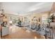 Inviting living room featuring hardwood floors, sliding glass doors, and an adjacent dining area at 4886 Westchester Ct, Oldsmar, FL 34677