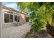 Small patio with seating area, adjacent to house at 4886 Westchester Ct, Oldsmar, FL 34677