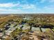 An aerial view of the Tennis courts in a community with a lake nearby at 4886 Westchester Ct, Oldsmar, FL 34677