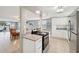 Updated kitchen featuring granite countertops and stainless steel appliances at 5102 Blue Heron Dr, New Port Richey, FL 34652