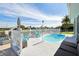 Relaxing pool area with turquoise pool and patio furniture at 5102 Blue Heron Dr, New Port Richey, FL 34652
