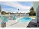 Relaxing pool area with turquoise pool and patio furniture at 5102 Blue Heron Dr, New Port Richey, FL 34652