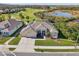 Single-Gathering home with a three-car garage and golf course view at 7302 Melogold Cir, Land O Lakes, FL 34637