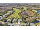 Aerial view showcasing homes and golf course at 7302 Melogold Cir, Land O Lakes, FL 34637