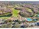 Community clubhouse with pool and golf course views at 7302 Melogold Cir, Land O Lakes, FL 34637