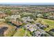 Bird's eye view of neighborhood and golf course at 7302 Melogold Cir, Land O Lakes, FL 34637