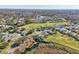Community overview with golf course and lake at 7302 Melogold Cir, Land O Lakes, FL 34637