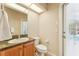 Small bathroom with toilet and single sink vanity at 7302 Melogold Cir, Land O Lakes, FL 34637