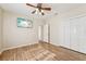 Spacious bedroom with wood flooring and ample closet space at 7302 Melogold Cir, Land O Lakes, FL 34637