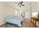 King-size bedroom with hardwood floors and private access to the bathroom at 7302 Melogold Cir, Land O Lakes, FL 34637