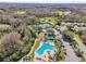 Resort-style pool with lounge chairs and landscaping at 7302 Melogold Cir, Land O Lakes, FL 34637
