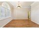 Formal dining room with hardwood floors and elegant chandelier at 7302 Melogold Cir, Land O Lakes, FL 34637