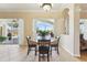 Bright dining room with pool and landscape view at 7302 Melogold Cir, Land O Lakes, FL 34637