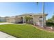 This charming home boasts a lush lawn and a three-car garage at 7302 Melogold Cir, Land O Lakes, FL 34637