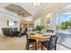 Bright Gathering room with pool view, fireplace and open floor plan at 7302 Melogold Cir, Land O Lakes, FL 34637