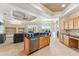 Open concept kitchen with island and views to Gathering room at 7302 Melogold Cir, Land O Lakes, FL 34637