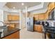 Well-equipped kitchen featuring granite counters and ample cabinetry at 7302 Melogold Cir, Land O Lakes, FL 34637