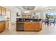 Kitchen island with granite countertops and stainless steel appliances at 7302 Melogold Cir, Land O Lakes, FL 34637