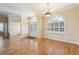 Bright and airy living room with hardwood floors and double doors at 7302 Melogold Cir, Land O Lakes, FL 34637