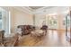 Bright living room featuring hardwood floors and ample natural light at 7302 Melogold Cir, Land O Lakes, FL 34637