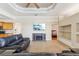 Living room with built-in shelving, fireplace, and comfortable seating at 7302 Melogold Cir, Land O Lakes, FL 34637