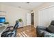 Home office with desk, two chairs, and built-in shelving at 7302 Melogold Cir, Land O Lakes, FL 34637