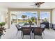 Relaxing pool area with patio furniture and screened enclosure at 7302 Melogold Cir, Land O Lakes, FL 34637