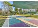 Enjoy two shaded shuffleboard courts with nearby picnic tables and tennis courts at 7302 Melogold Cir, Land O Lakes, FL 34637