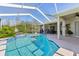 Large, refreshing pool with a screened enclosure at 7302 Melogold Cir, Land O Lakes, FL 34637