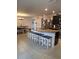 Spacious kitchen with an island, granite countertops, and stainless steel appliances at 8278 Silverbell Loop, Brooksville, FL 34613