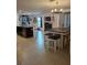 Open kitchen with large island, breakfast bar, and ample cabinet space at 8278 Silverbell Loop, Brooksville, FL 34613
